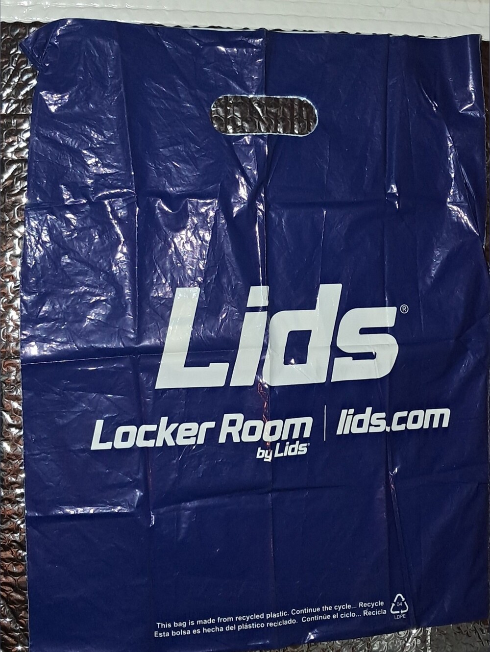 FREE with PURCHASE LIDS STORE BAG